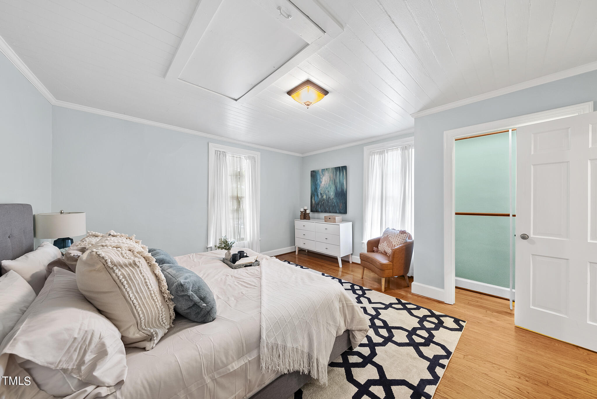 215 Pace Street Raleigh, NC 27604 - Photo 15 of 25 a bedroom with a bed and wooden floor