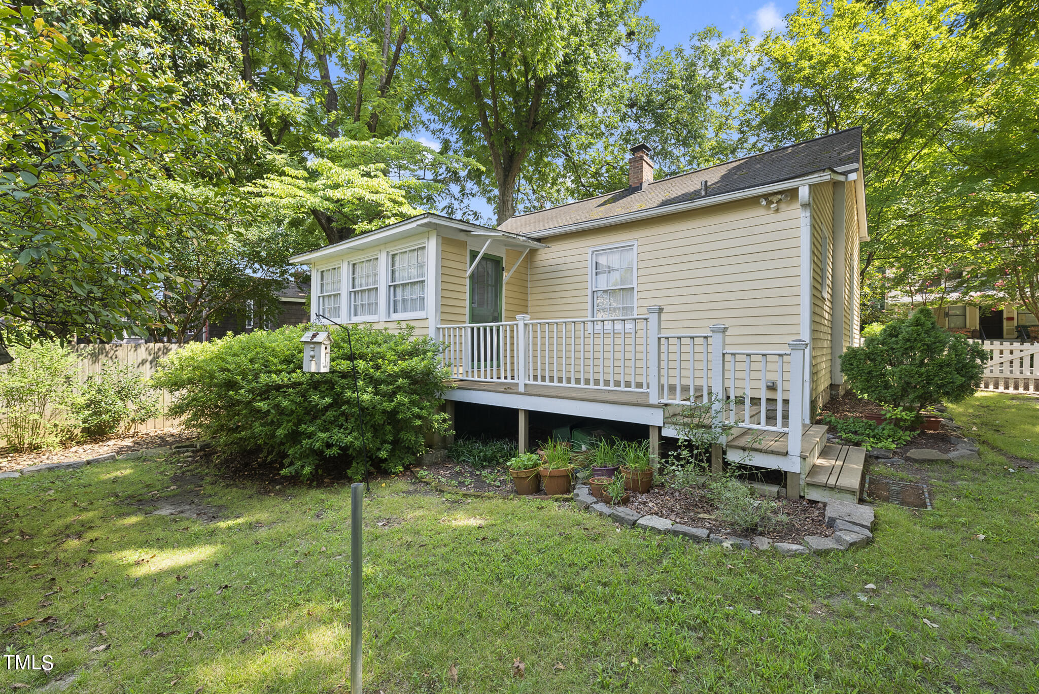 215 Pace Street Raleigh, NC 27604 - Photo 17 of 25 a view of a house with a backyard