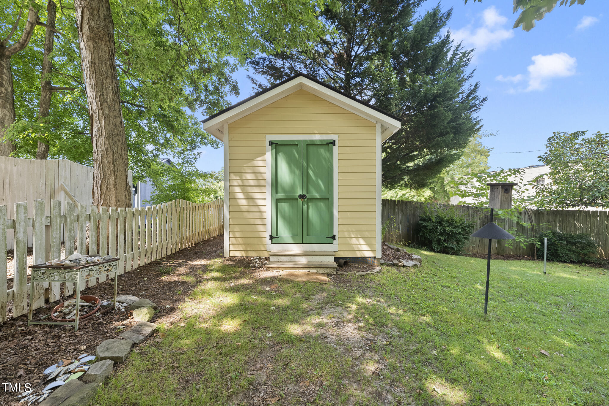 215 Pace Street Raleigh, NC 27604 - Photo 19 of 25 a front view of a house with a yard and garage