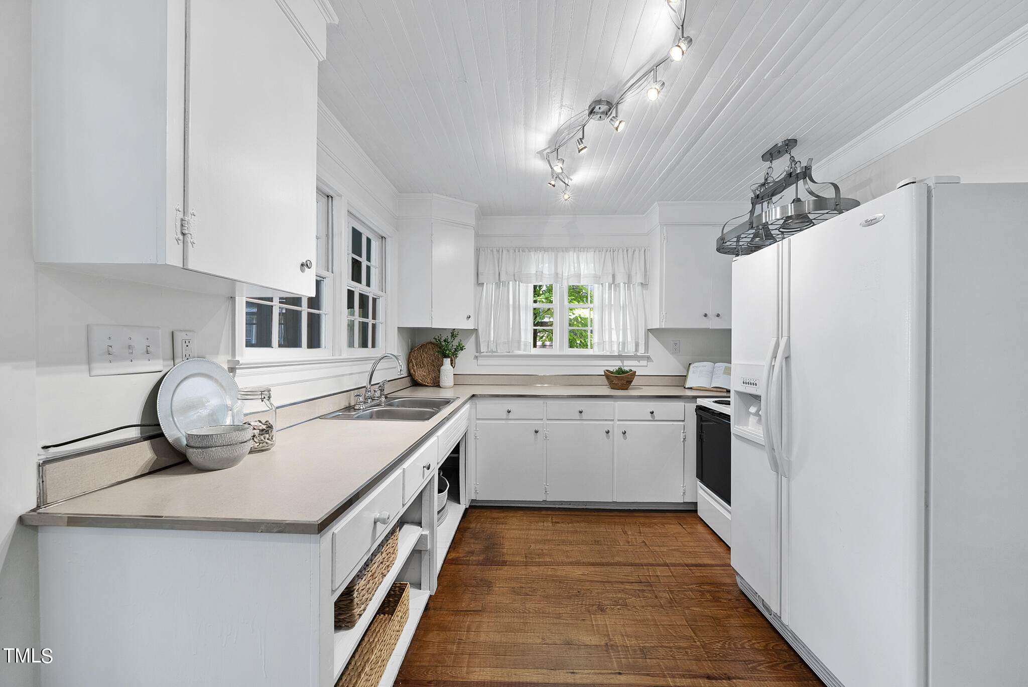 215 Pace Street Raleigh, NC 27604 - Photo 6 of 25 a kitchen with a refrigerator a sink and dishwasher with wooden floor