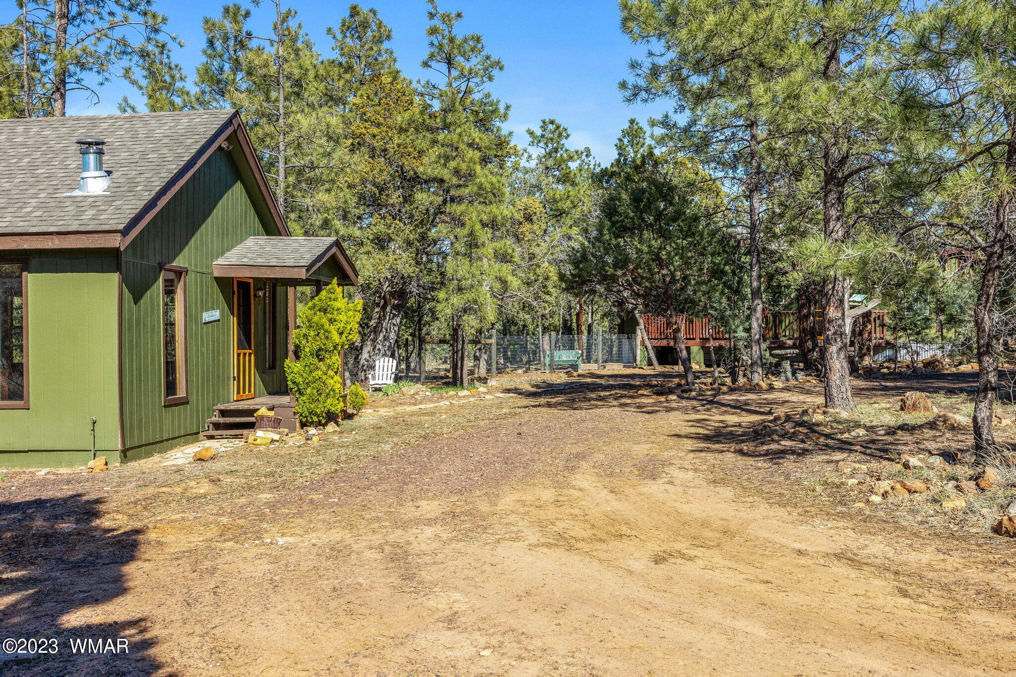 2001 Judy Ranch Road Overgaard, AZ 85933 - Photo 15 of 41 a view of a house with large trees and playing area
