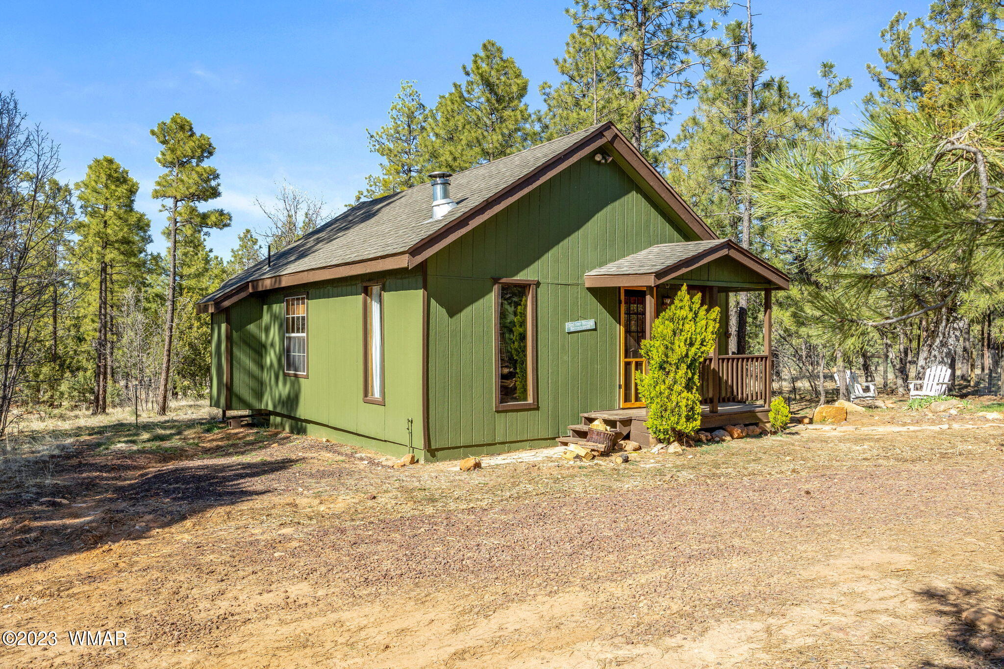 2001 Judy Ranch Road Overgaard, AZ 85933 - Photo 16 of 41 a front view of a house with a yard