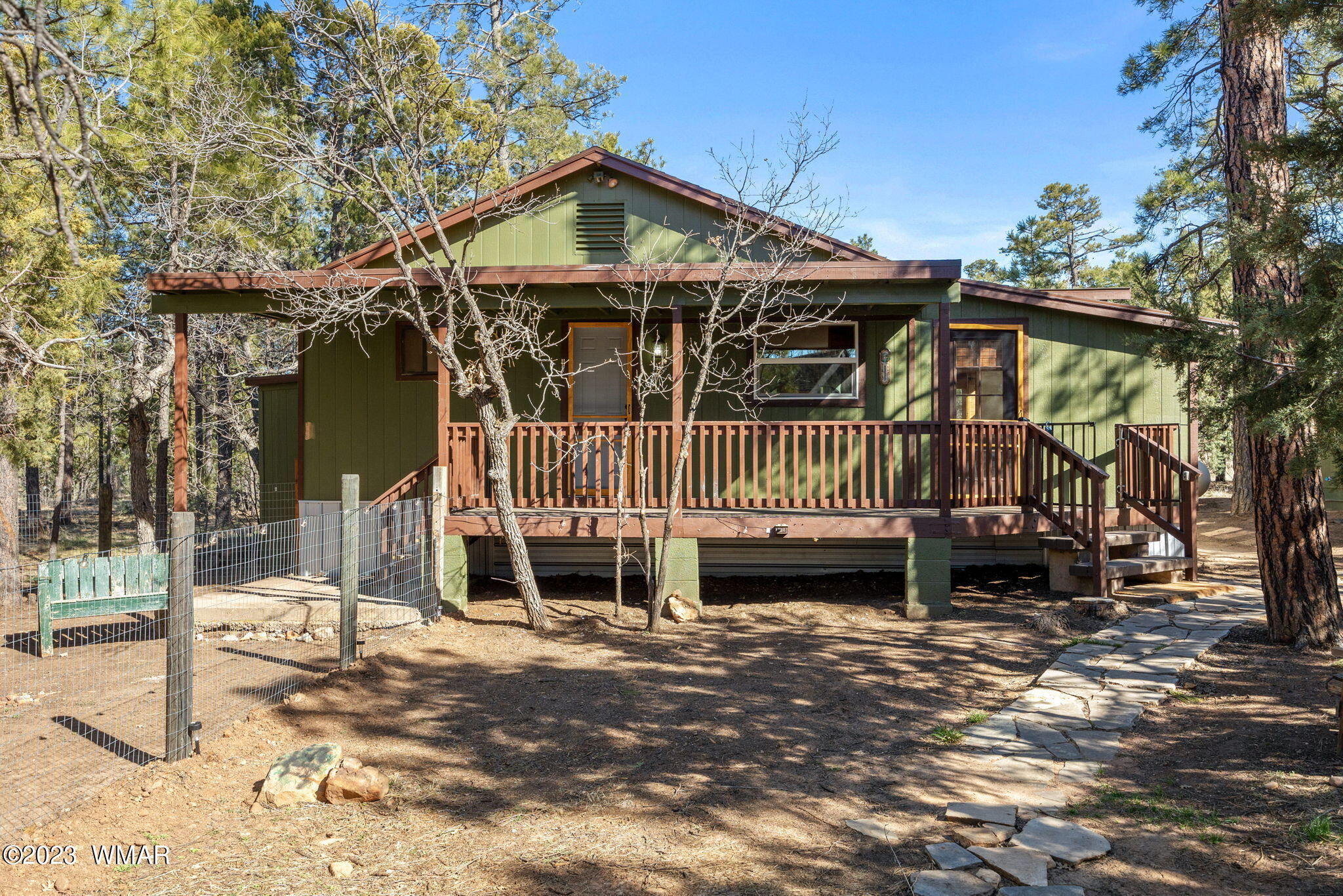 2001 Judy Ranch Road Overgaard, AZ 85933 - Photo 2 of 41 a view of a house with wooden deck front of house