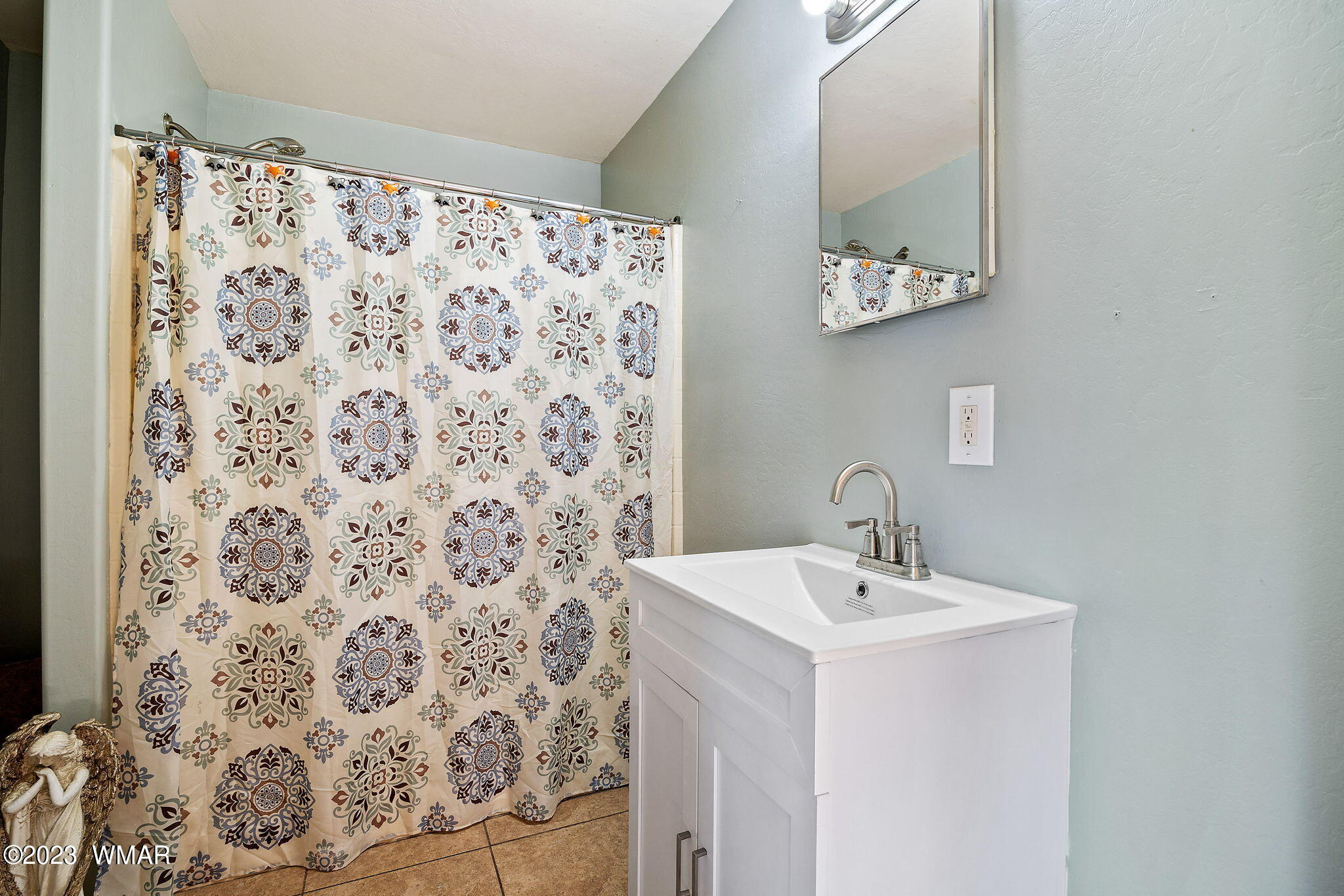 2001 Judy Ranch Road Overgaard, AZ 85933 - Photo 23 of 41 a bathroom with a sink and a mirror