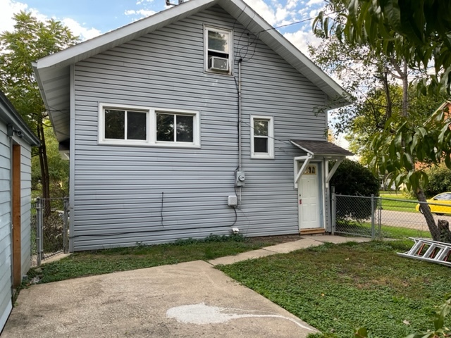 829 North 7th Street Rochelle, IL 61068 - Photo 23 of 24 a front view of a house with a yard