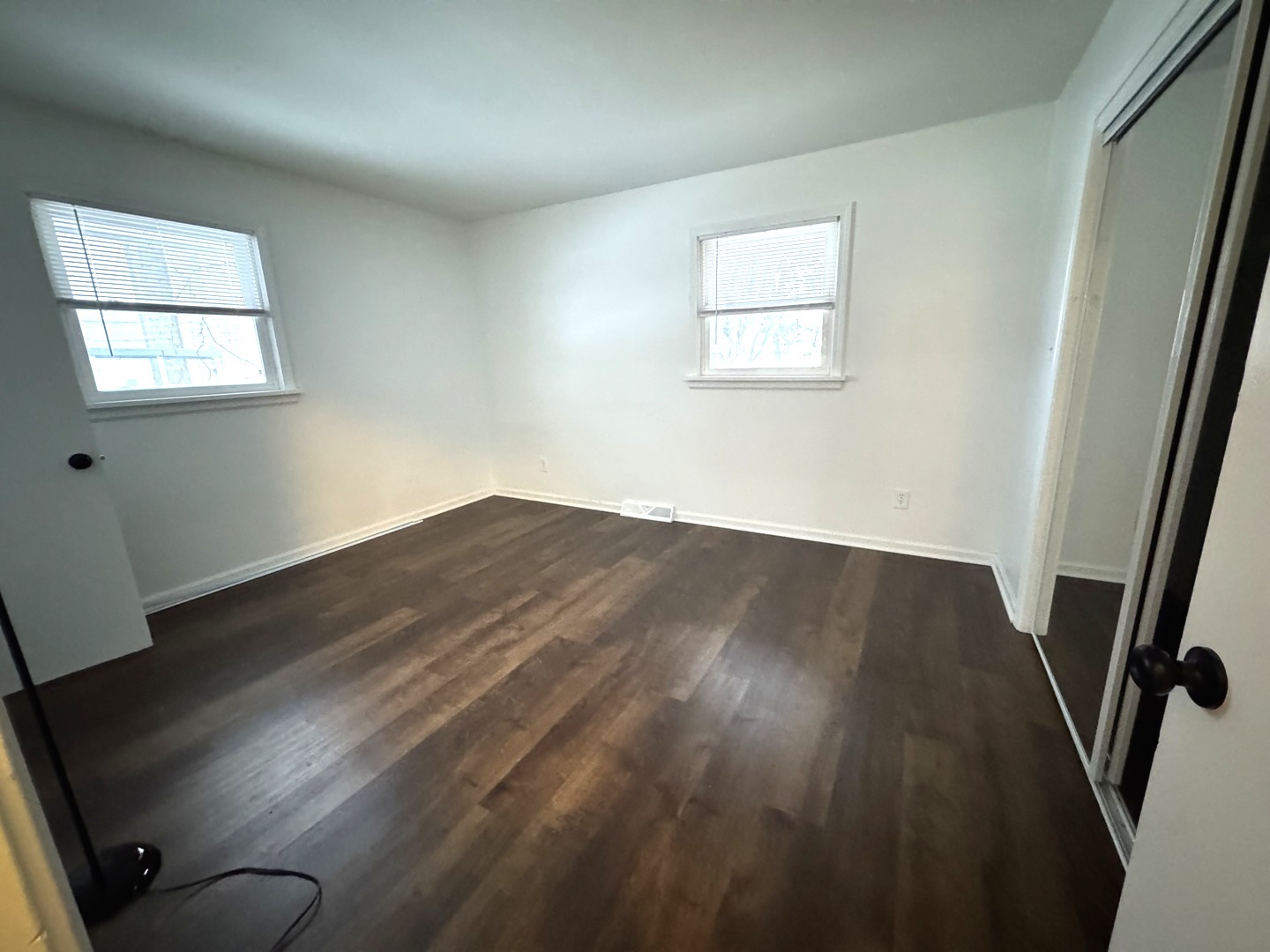 11268 Faxon Road Yorkville, IL 60560 - Photo 12 of 13 an empty room with wooden floor and windows