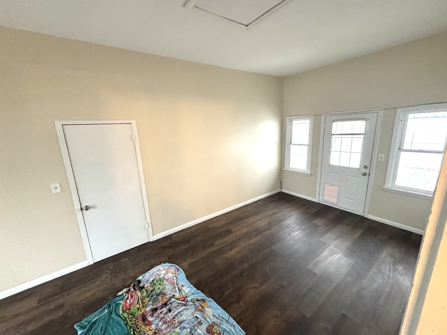 11268 Faxon Road Yorkville, IL 60560 - Photo 7 of 13 an empty room with wooden floor and windows
