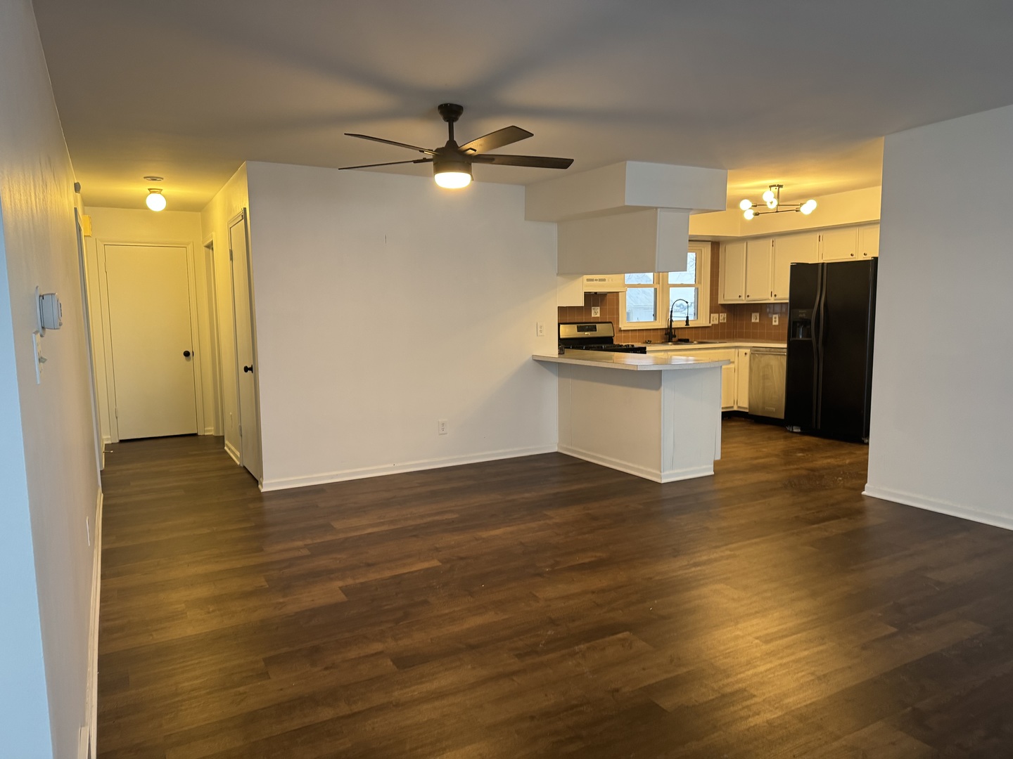 11268 Faxon Road Yorkville, IL 60560 - Photo 8 of 13 a kitchen with a refrigerator and a sink