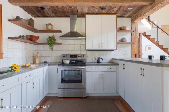 a kitchen with stainless steel appliances granite countertop a sink and cabinets
