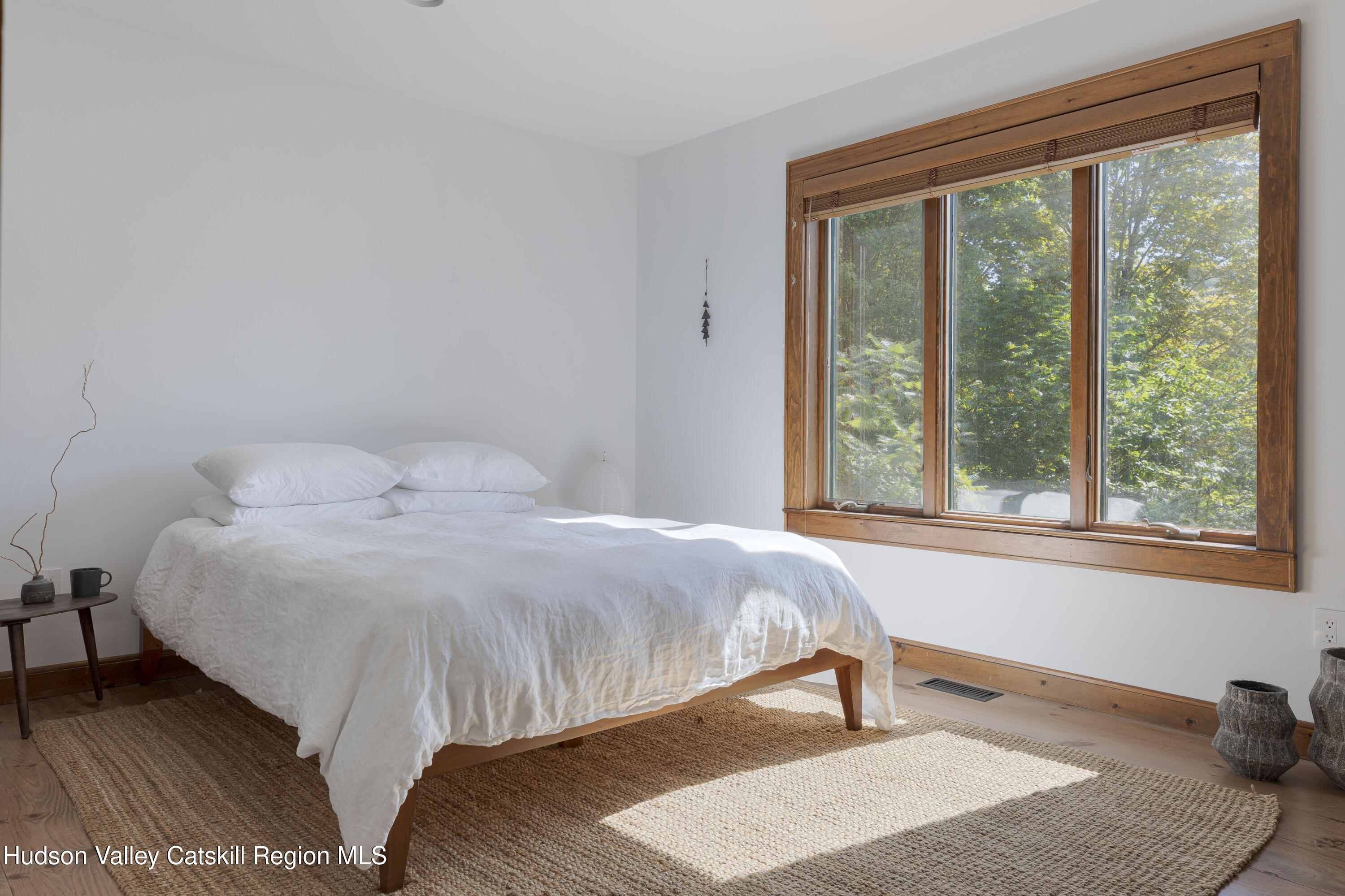 396 Doig Hollow Road Bovina, NY 13731 - Photo 28 of 44 a bedroom with a bed and a window