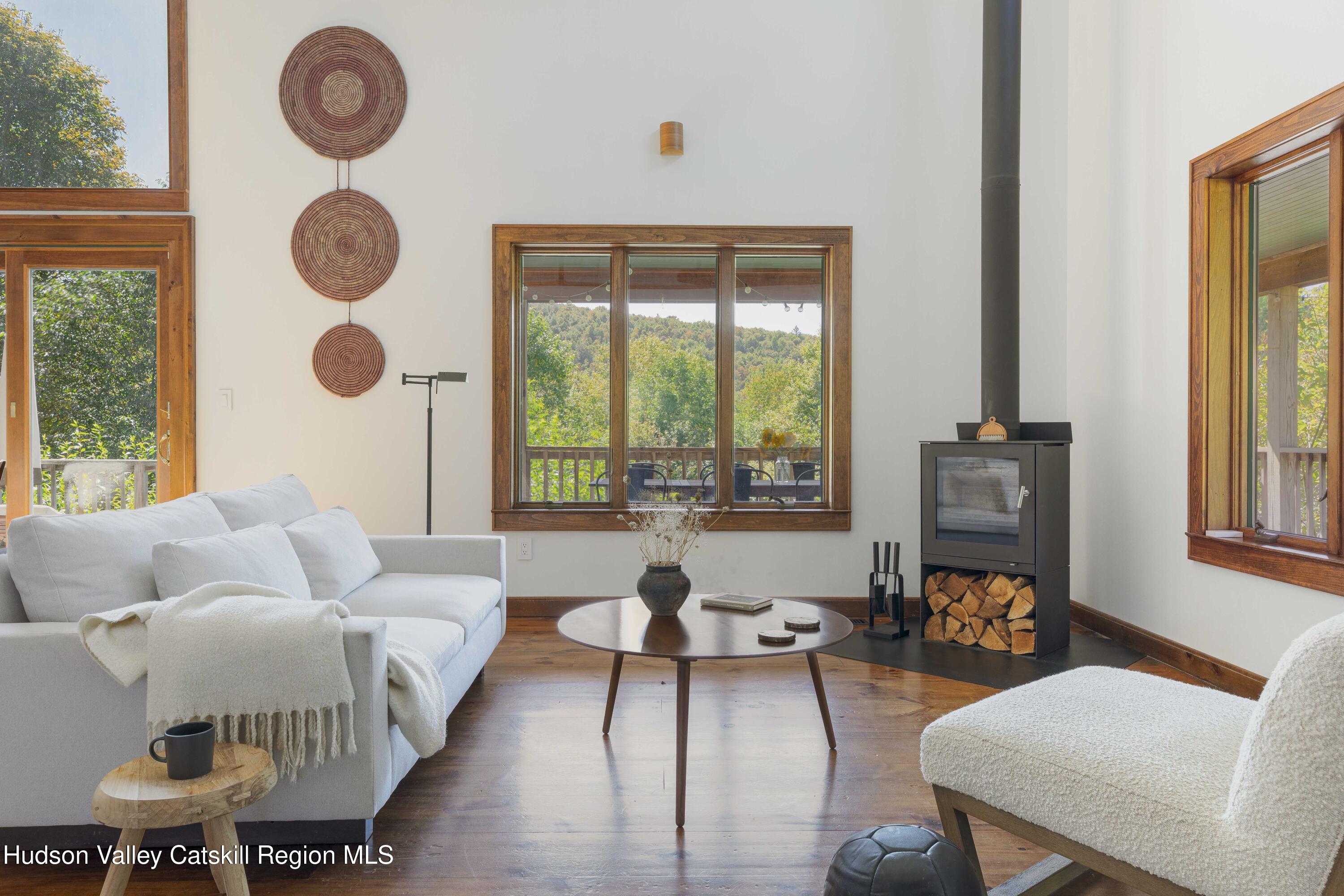 396 Doig Hollow Road Bovina, NY 13731 - Photo 3 of 44 a living room with furniture and a large window