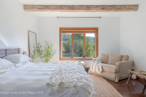 a bedroom with a bed and a closet