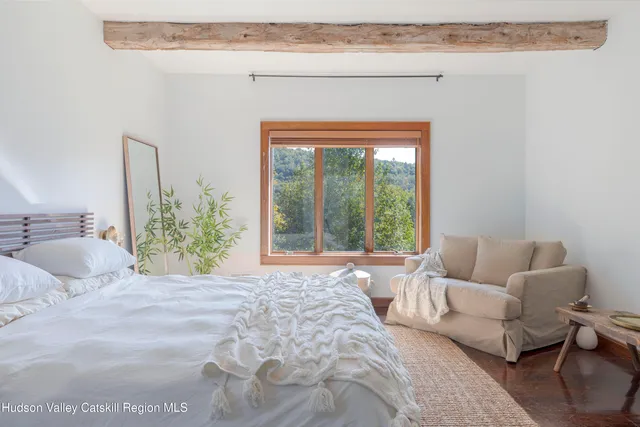 a bedroom with a bed and a closet