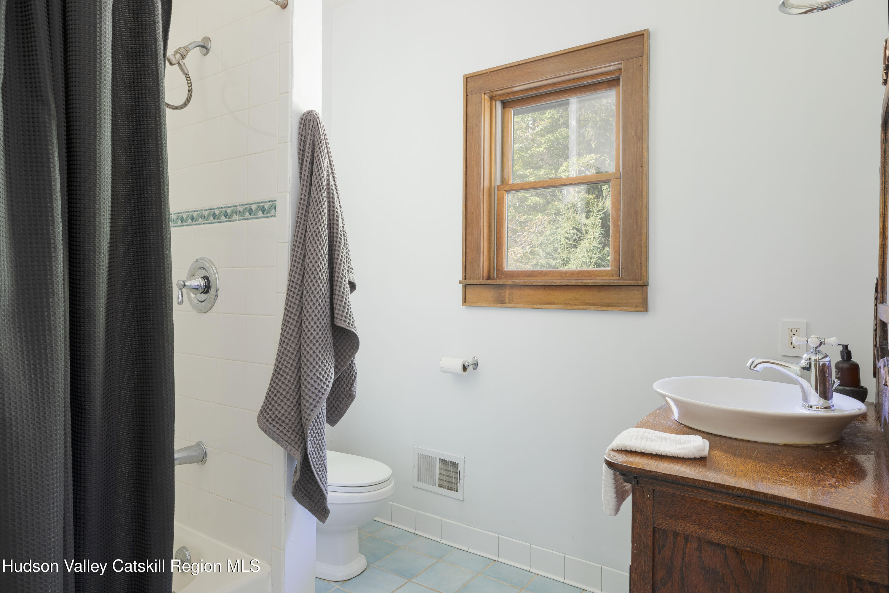 396 Doig Hollow Road Bovina, NY 13731 - Photo 36 of 44 a bathroom with a toilet sink and mirror