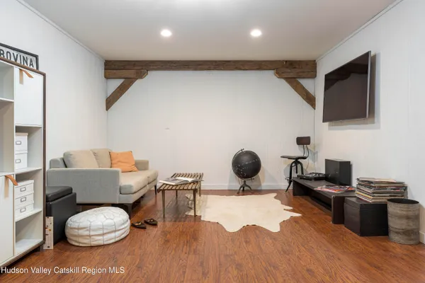 a view of a balcony with wooden floor and fence