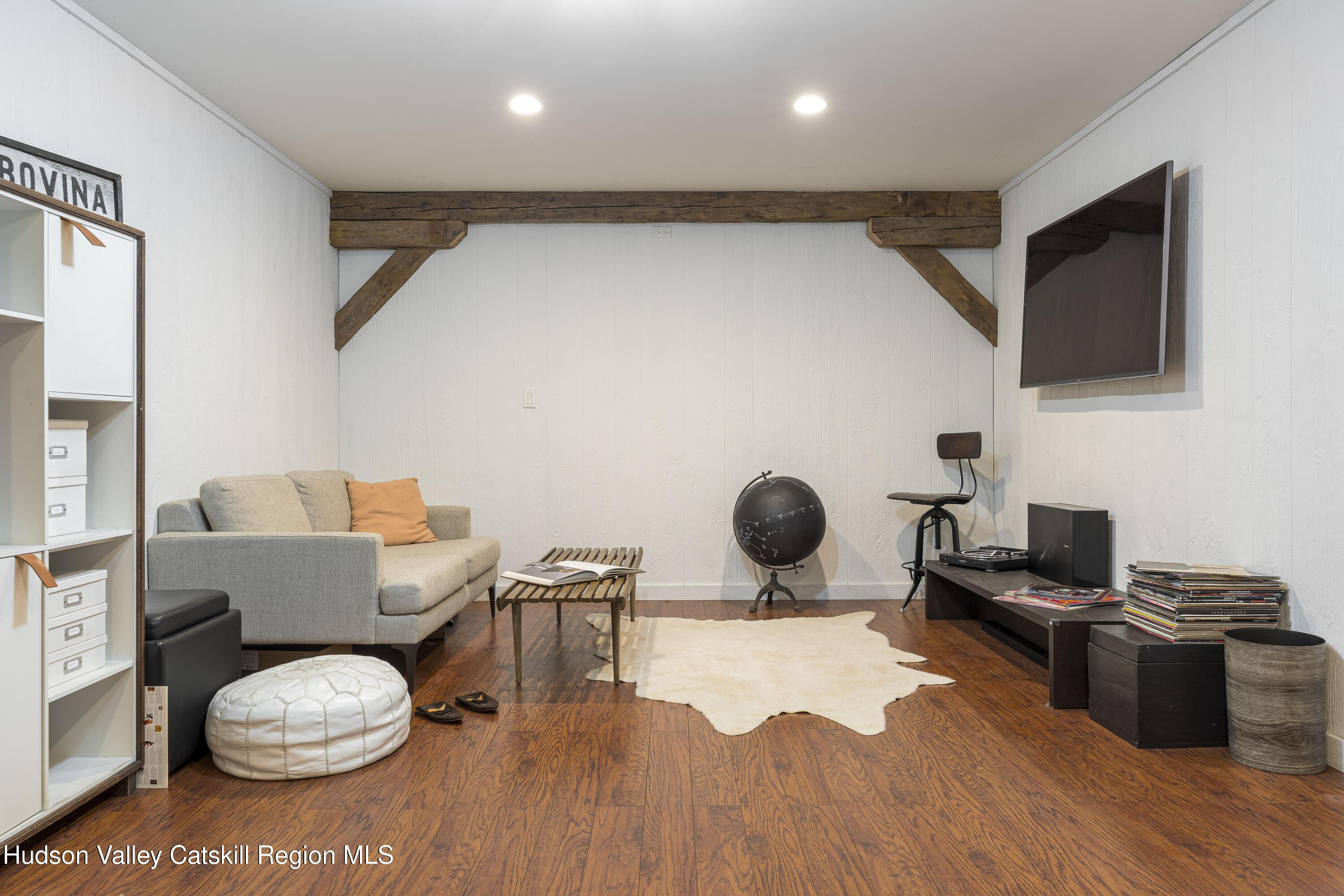 396 Doig Hollow Road Bovina, NY 13731 - Photo 37 of 44 a living room with furniture and a flat screen tv