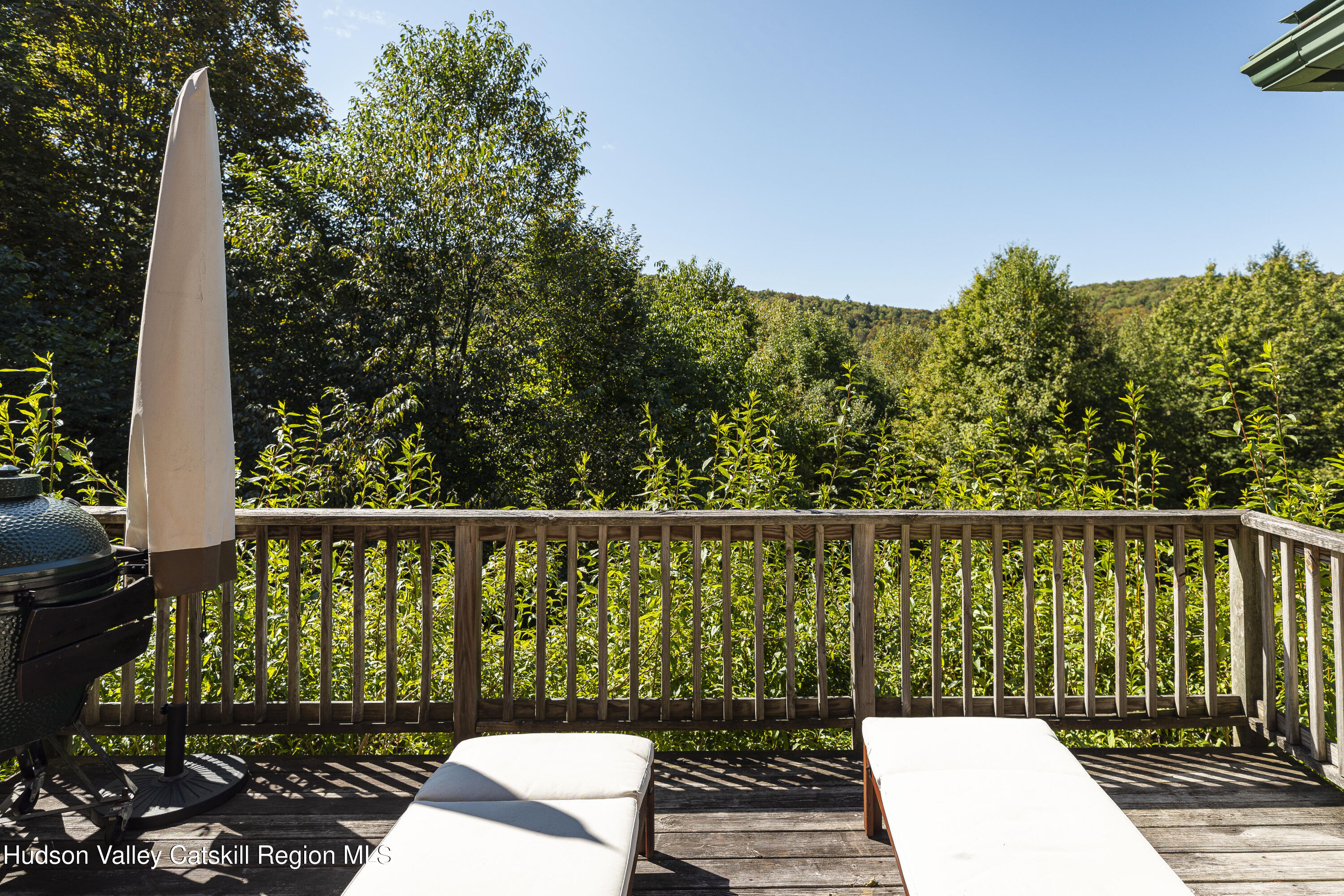 396 Doig Hollow Road Bovina, NY 13731 - Photo 38 of 44 a view of a balcony with wooden floor and fence