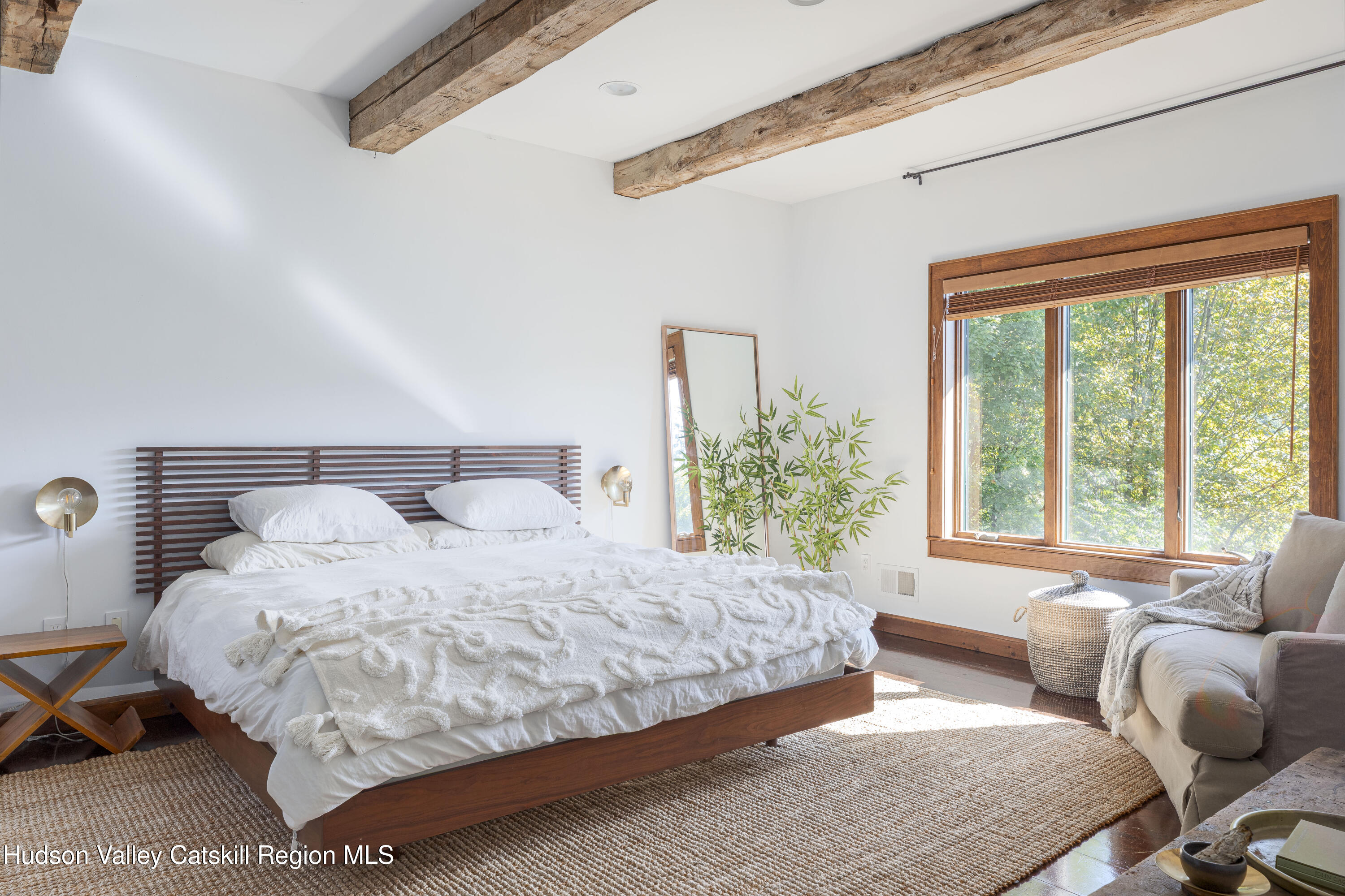 396 Doig Hollow Road Bovina, NY 13731 - Photo 5 of 44 a bedroom with bed couch and window