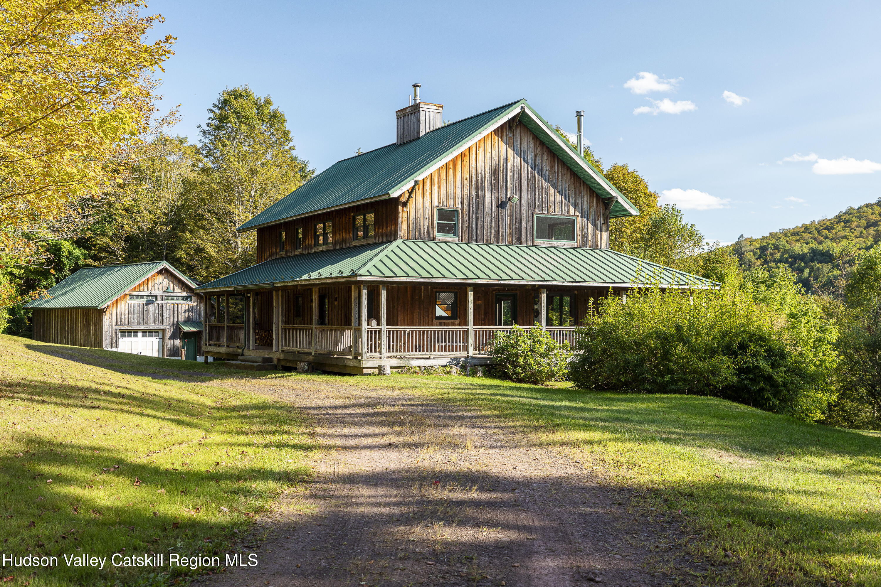 396 Doig Hollow Road Bovina, NY 13731 - Photo 10 of 44 a front view of a house with yard and green space