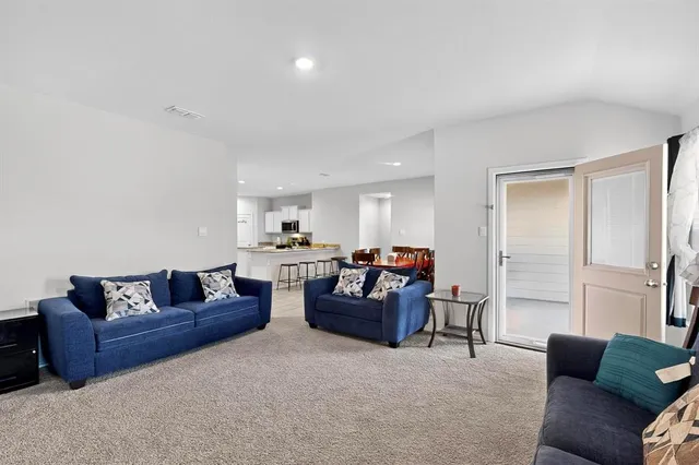 a living room with furniture and a couch