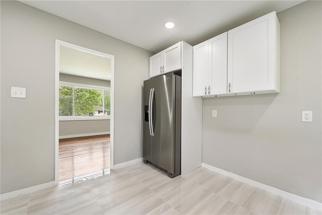 614 Springdale Drive Pittsburgh, PA 15235 - Photo 13 of 31 a view of an empty room with a kitchen