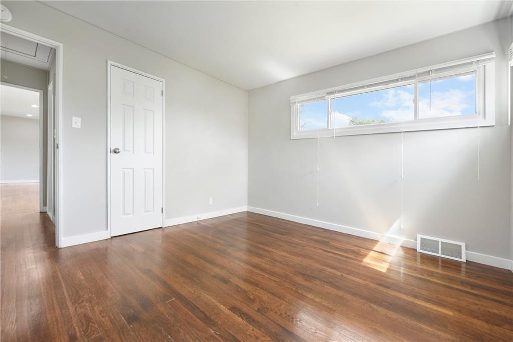 614 Springdale Drive Pittsburgh, PA 15235 - Photo 16 of 31 a view of empty room with wooden floor and fan