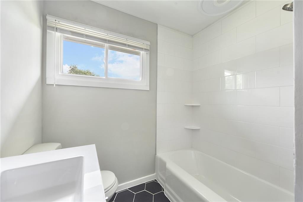 614 Springdale Drive Pittsburgh, PA 15235 - Photo 20 of 31 a white bath tub sitting next to a white toilet