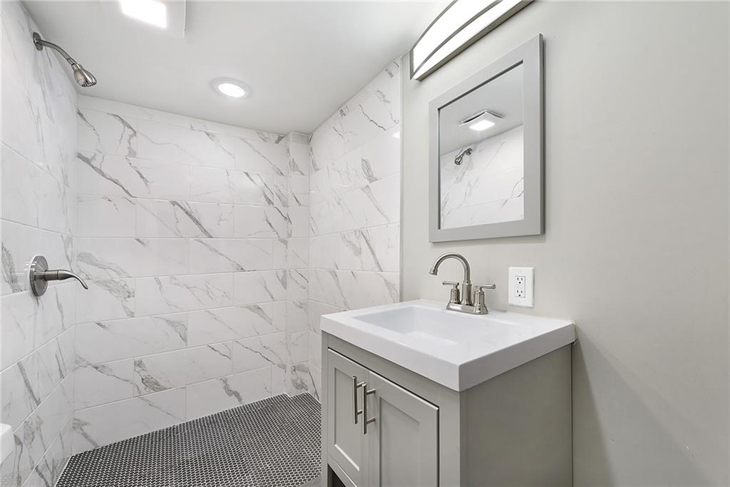 614 Springdale Drive Pittsburgh, PA 15235 - Photo 26 of 31 a bathroom with a sink and a mirror