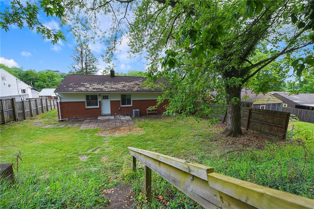 614 Springdale Drive Pittsburgh, PA 15235 - Photo 30 of 31 a view of a house with backyard and a tree
