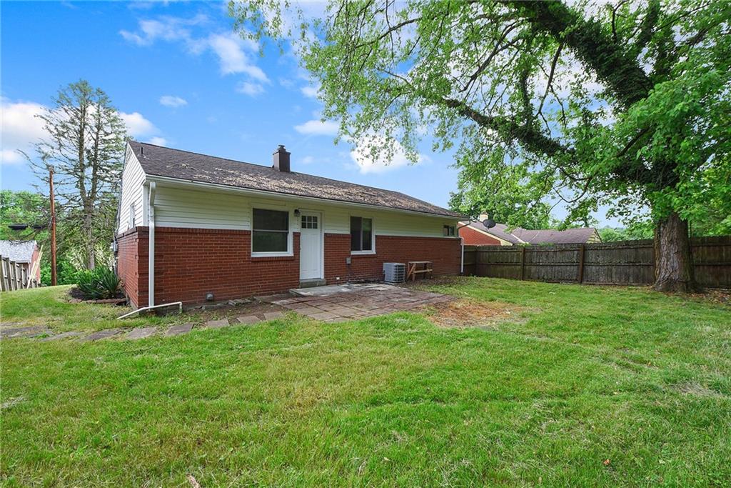 614 Springdale Drive Pittsburgh, PA 15235 - Photo 31 of 31 a backyard of a house with seating space