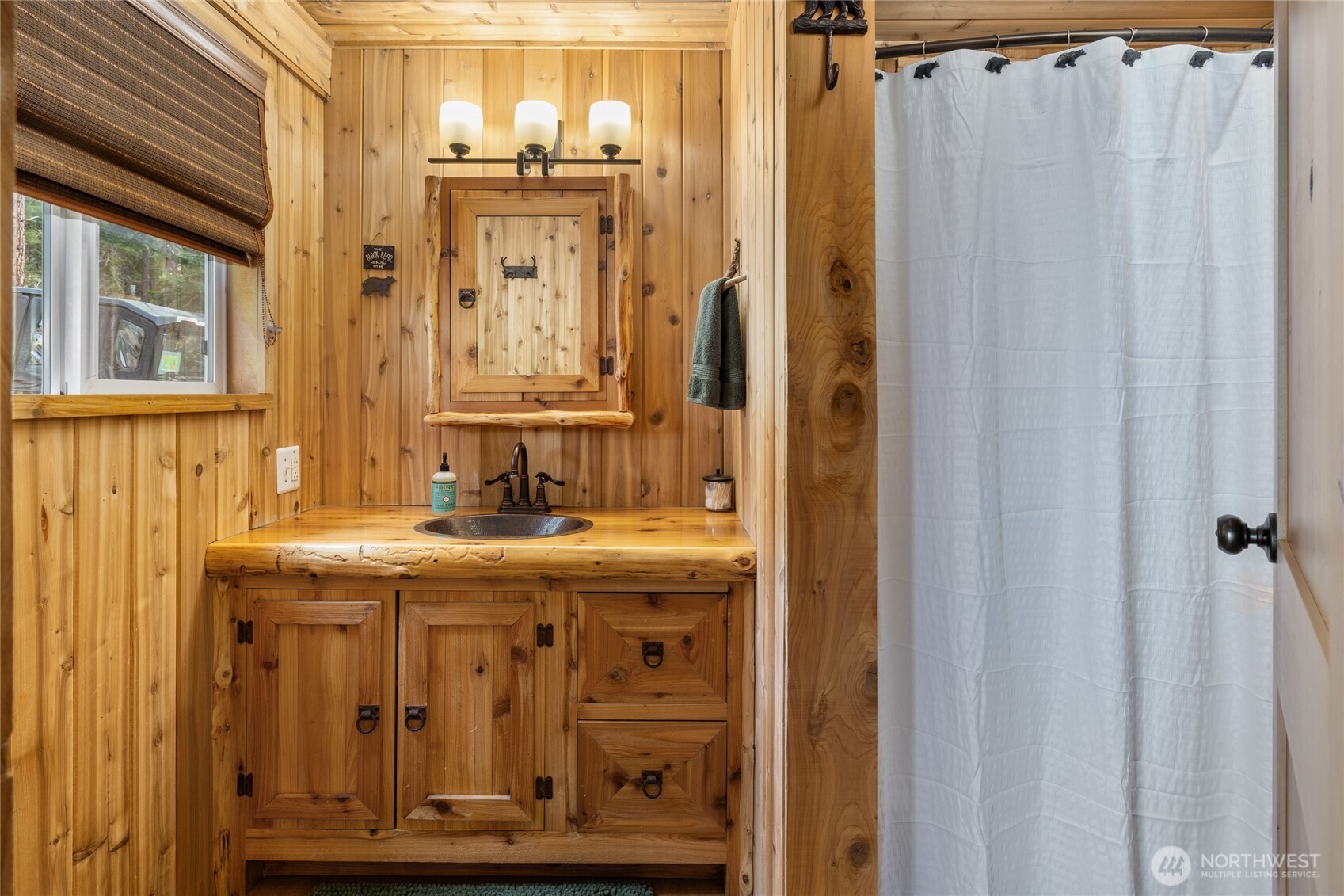 110 Deer Point Lane Ronald, WA 98940 - Photo 16 of 40 a view of a bathroom with a sink and mirror
