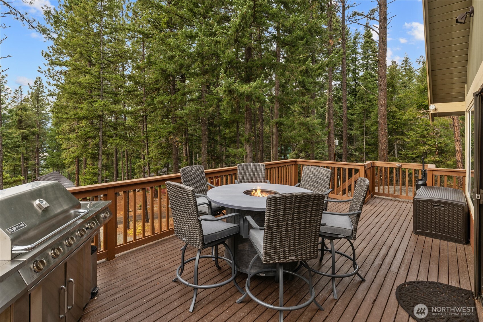 110 Deer Point Lane Ronald, WA 98940 - Photo 24 of 40 a view of a roof deck with table and chairs with wooden floor and fence