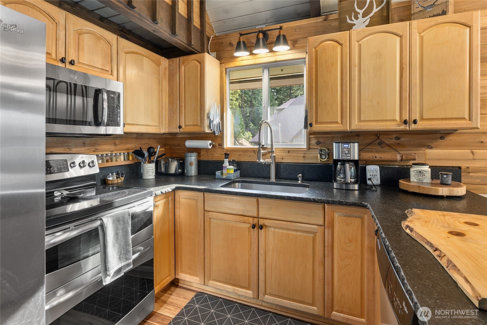 110 Deer Point Lane Ronald, WA 98940 - Photo 8 of 40 a kitchen with stainless steel appliances granite countertop a sink a stove and cabinets