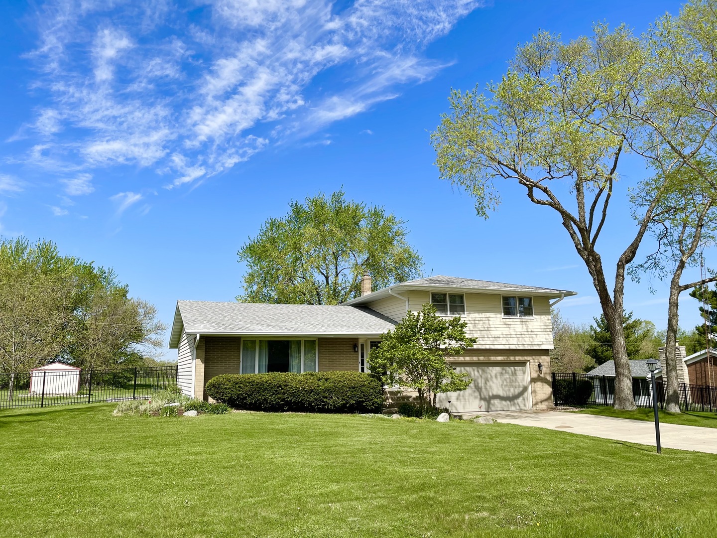 2561 East 259th Road Peru, IL 61354 - Photo 1 of 26 a front view of a house with a garden