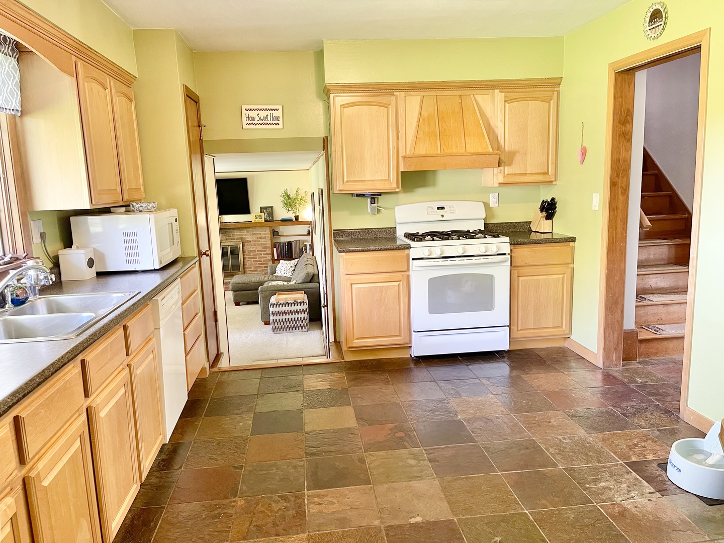 2561 East 259th Road Peru, IL 61354 - Photo 15 of 26 a kitchen with a stove a sink and a refrigerator