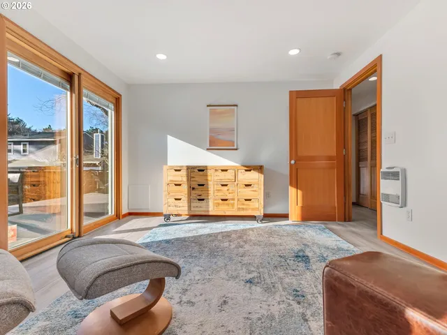 a bedroom with a bed and a couch