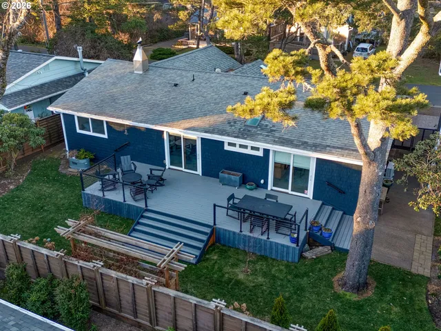 a view of house with a yard