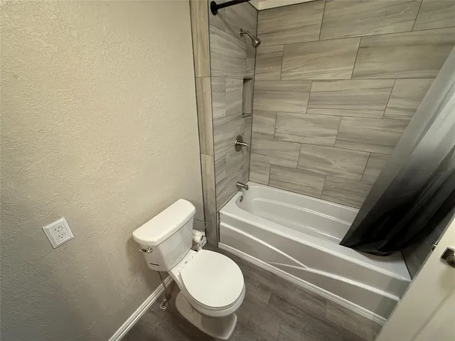 a bathroom with a toilet and a vanity