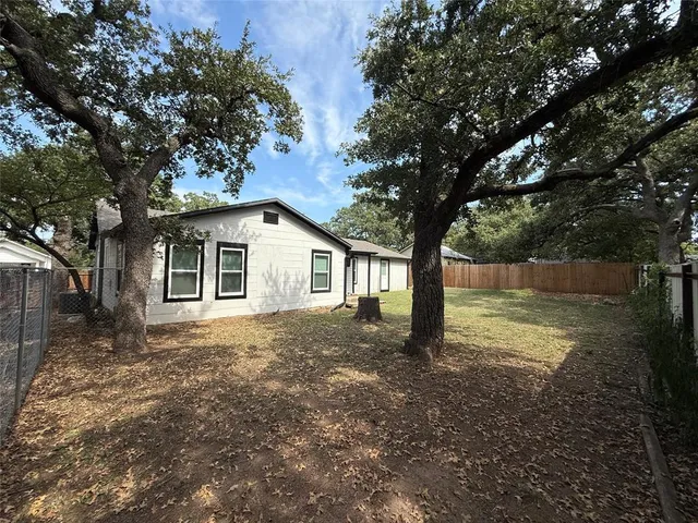 a house with trees in front of it