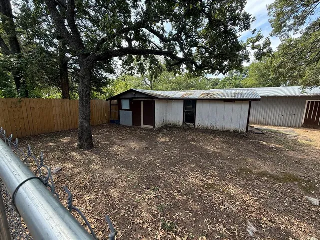 a backyard of a house with lots of green space