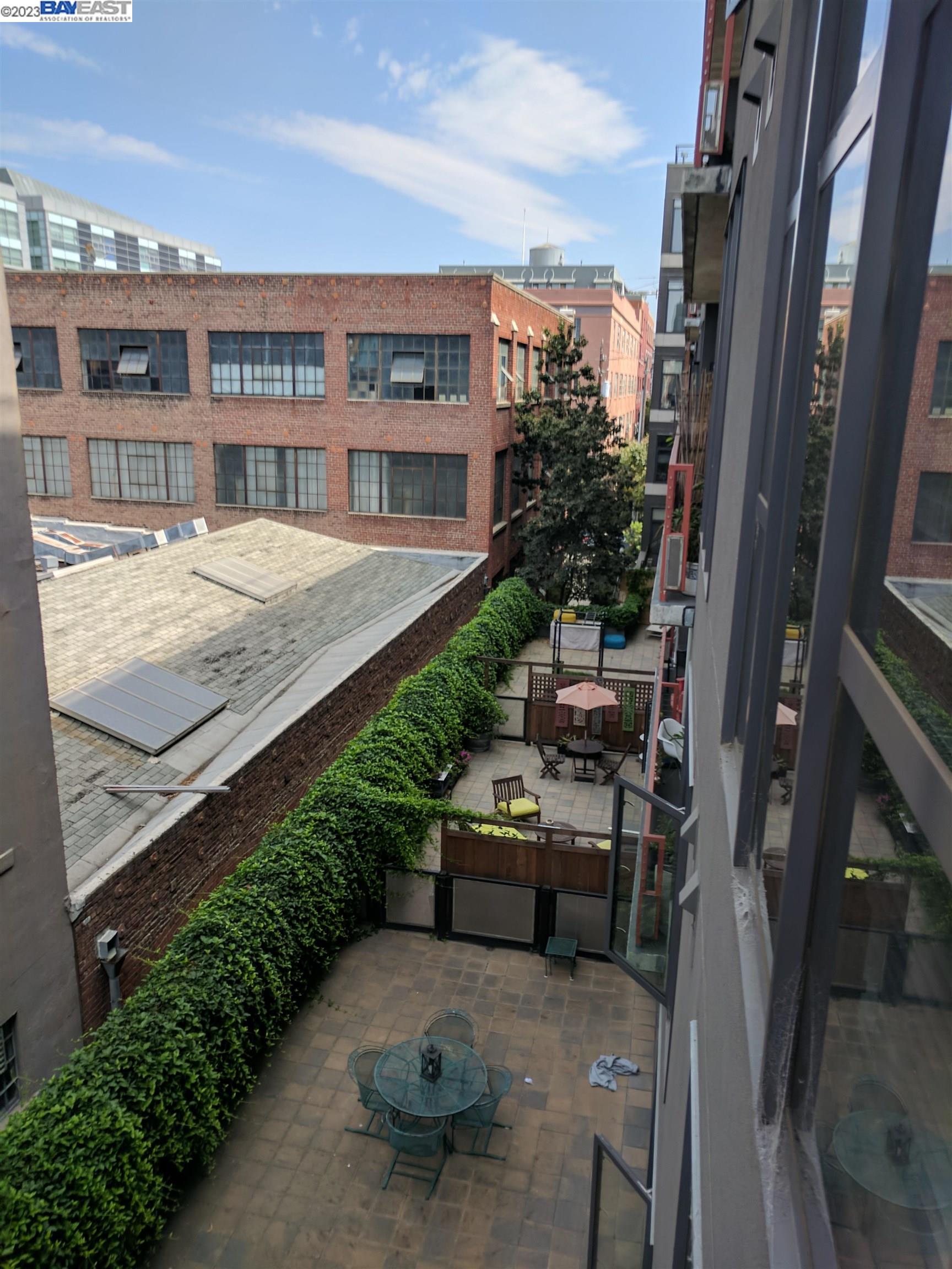 288 3rd Street, Unit 407 Oakland, CA 94607 - Photo 17 of 24 a view of a balcony with chairs and a table