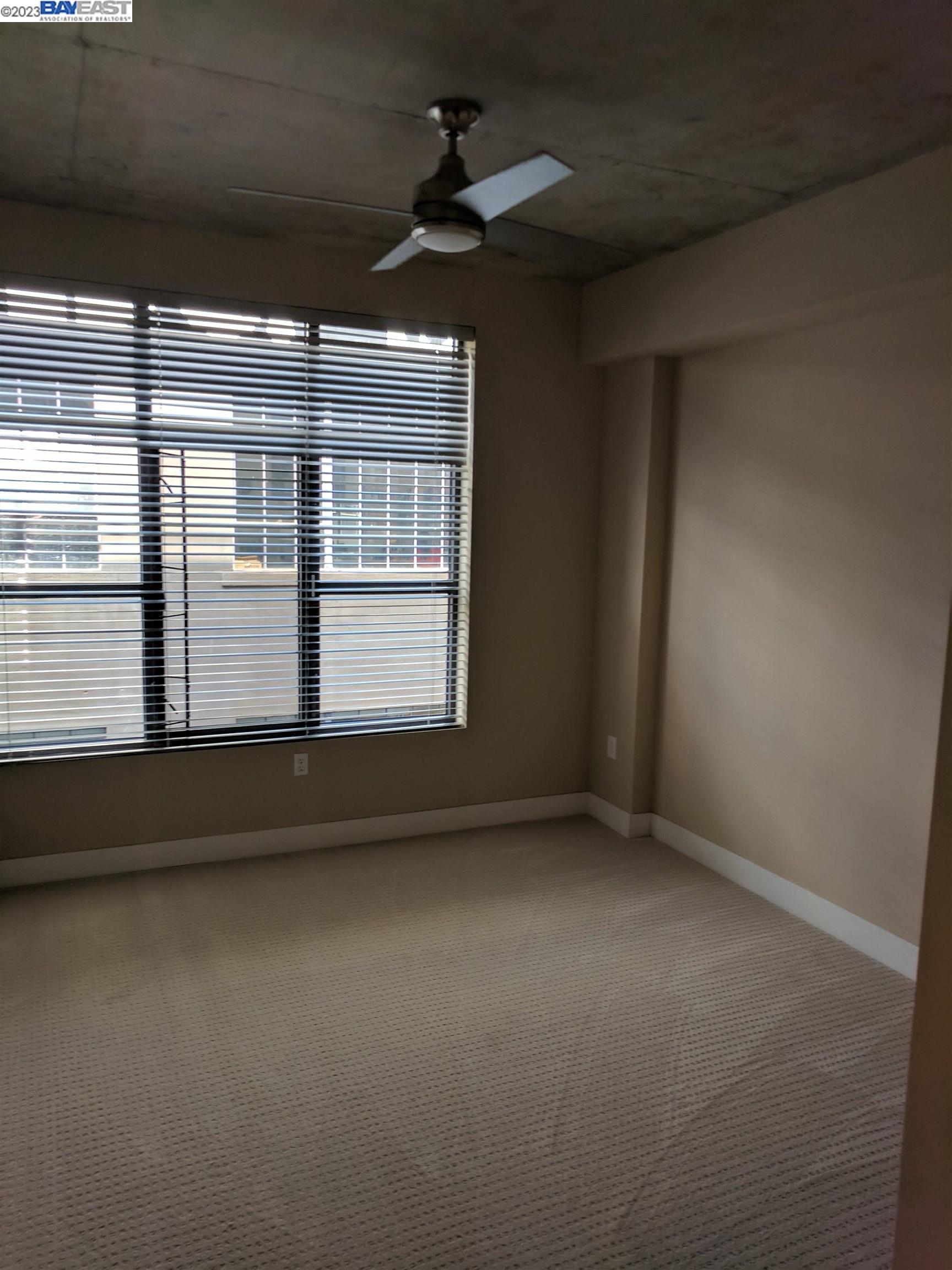 288 3rd Street, Unit 407 Oakland, CA 94607 - Photo 7 of 24 a view of empty room with ceiling fan