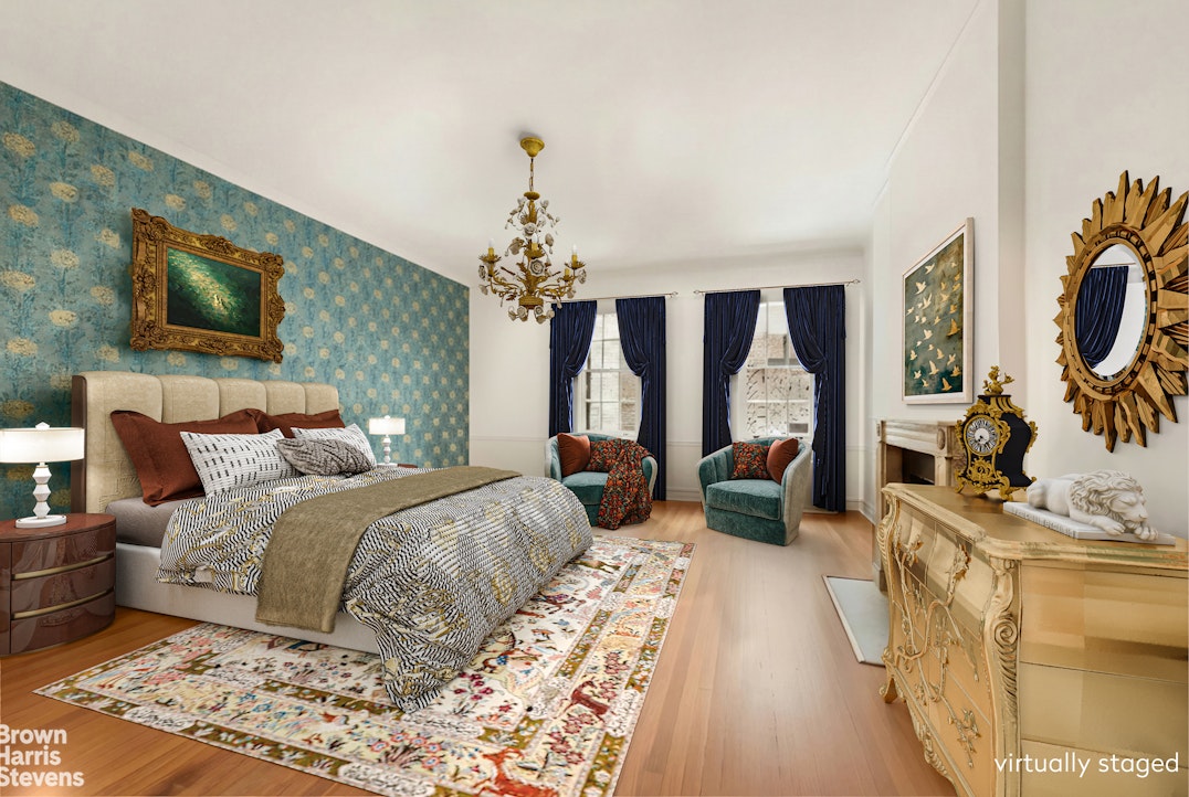 52 East 69th Street Manhattan, NY 10021 - Photo 12 of 20 a bedroom with bed and glass door