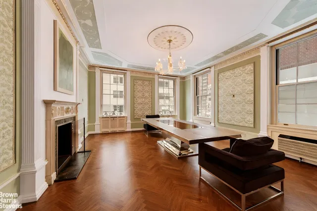 a living room with furniture fireplace and flat screen tv