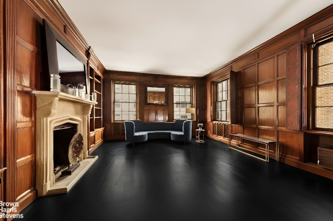 52 East 69th Street Manhattan, NY 10021 - Photo 4 of 20 a hallway with a large window and a fireplace