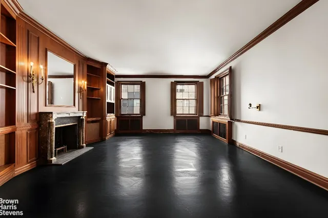 a view of a kitchen with a sink dishwasher stove and wooden floor