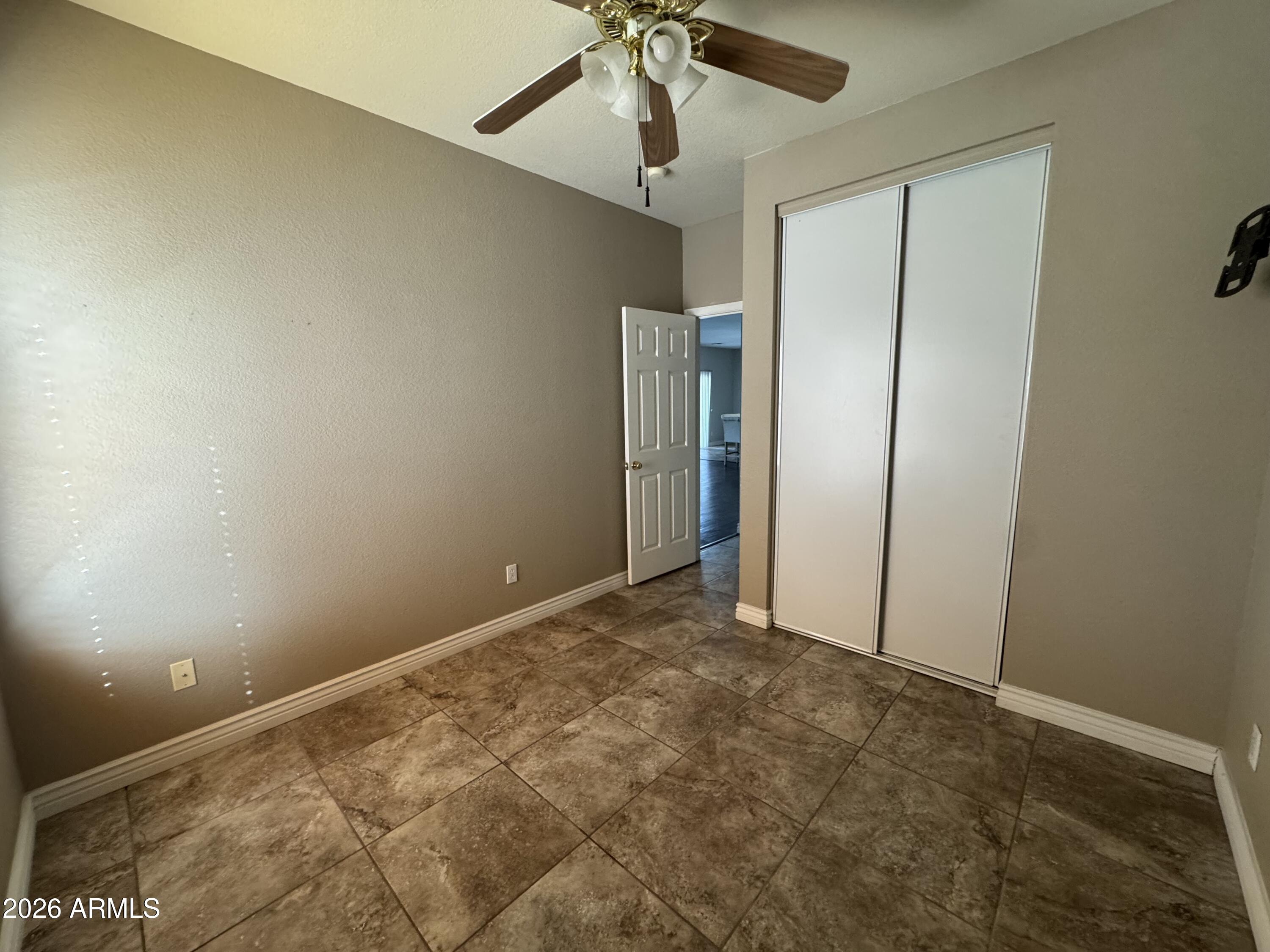 3750 East Orchid Lane Gilbert, AZ 85296 - Photo 13 of 43 a view of an empty room and a ceiling fan