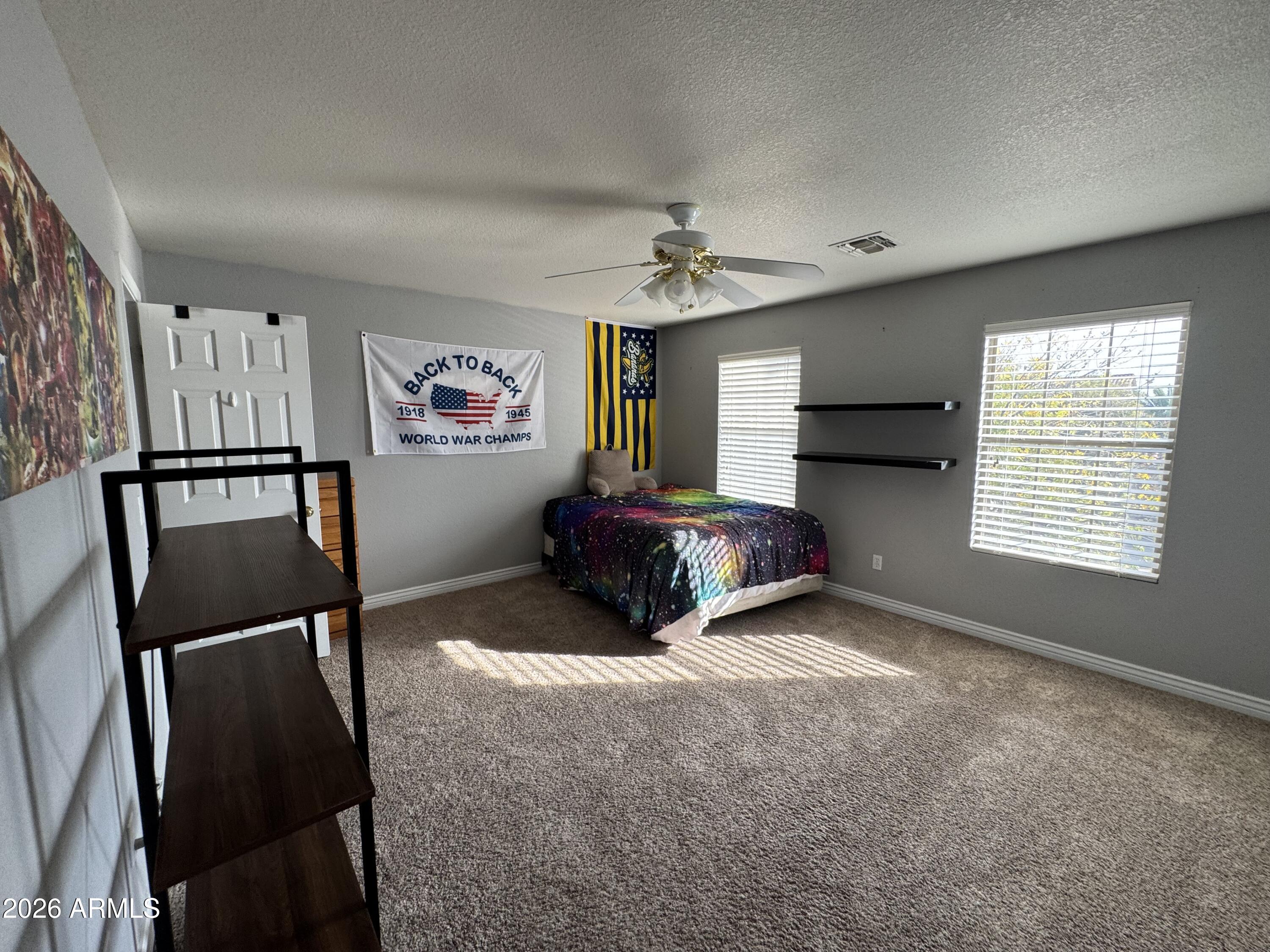3750 East Orchid Lane Gilbert, AZ 85296 - Photo 29 of 43 a living room with furniture and a window