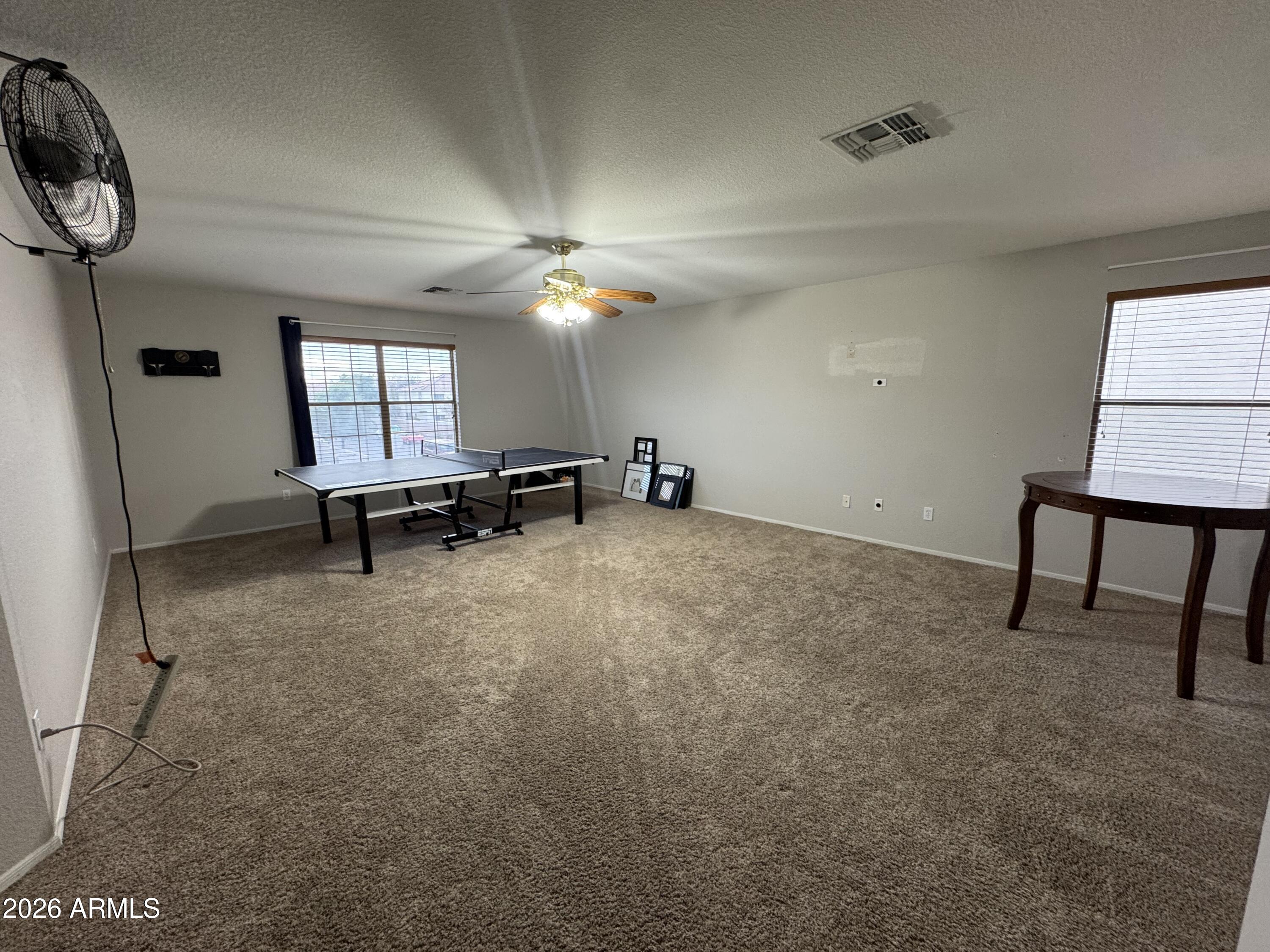 3750 East Orchid Lane Gilbert, AZ 85296 - Photo 31 of 43 a view of a livingroom with furniture and a window