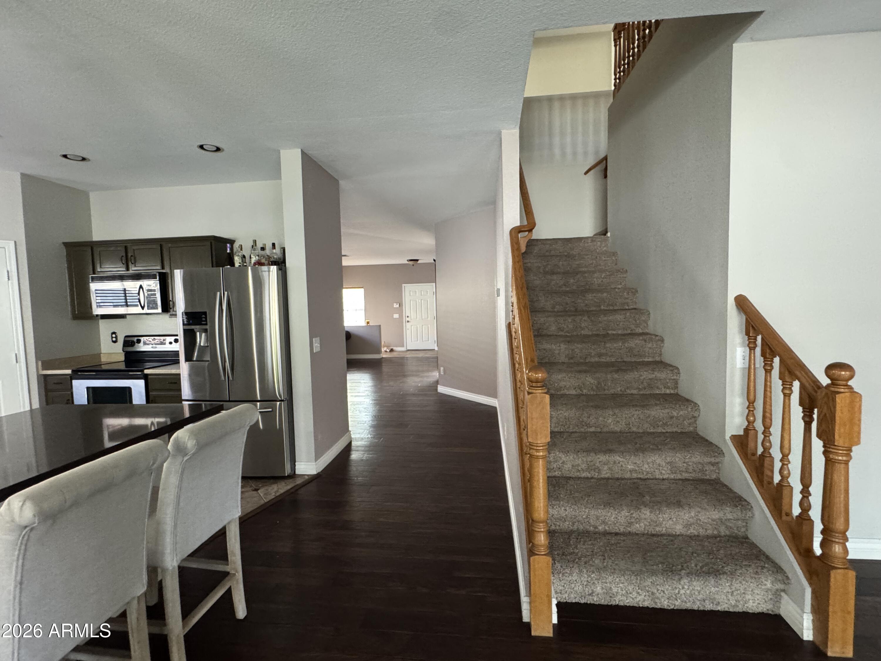 3750 East Orchid Lane Gilbert, AZ 85296 - Photo 7 of 43 a view of a hallway with furniture and wooden floor